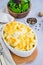 Mac and cheese. Traditional baked macaroni with cheese in baking form. American cuisine. Vertical orientation.