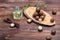 Macadamia kernels, walnut oil, on wooden background. Relax, health care, body care