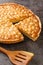 Macadamia tart nuts and creamy luxurious golden filling and baked in a buttery homemade shortcrust pastry closeup in the board.