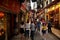 Macanese people and foreign travelers walk travel visit shopping small alley Travessa da Paixao in Senado Senate Square at UNESCO