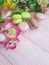 Macaron pink wooden background, flower,vintage flower