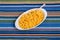 Macaroni and Cheese with Fork on Striped Placemat