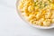 Macaroni creamy corn cheese on plate