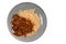 Macaroni with meatballs and ketchup in a plate isoated on white background