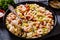 Macaroni salad with shrimps, mussels, fish, leek