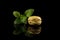 Macarons, Beautiful Green Macaron with Green leaves, modern design isolated on black background with reflections, centered