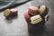 Macarons  on dark background. Healthy cake dessert made from almond flour. Vintage dark toned image