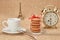 Macarons.Gold alarm clock, cup coffee,Eiffel Tower