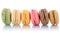 Macarons macaroons cookies dessert from France in a row isolated