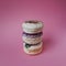 Macarons on pink background, Beautiful dessert three things in column