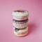 Macarons on pink background, Beautiful dessert three things in column