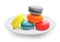 Macarons in plate on white background