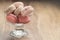 Macarons with strawberry, rose and caramel flavour in glass bowl