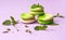 Macaroon cookies with mint flavor on a purple background