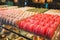 Macaroons cakes in confectionery shop. Colorful Italian sweets. Traditional food for breakfast