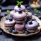 macaroons with fresh blueberries on a plate