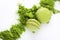 Macaroons with green tea powder matcha on white background