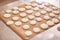 macaroons shells in a tray. Process of making macaron, french dessert,