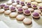 Macaroons shells in a tray. Process of making macaron, french dessert,