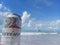 MACEIO, AL, BRAZIL - May 12, 2019: Budweiser cold beer and a beautiful sky and sea behind