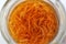 Macerating marigold - calendula - in a clear glass bottle