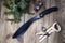 Machete on wooden background and coniferous branches. Machete top view.