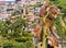 Machin monkey sculpture with Carmen hill borough in background, Guayaquil, Ecuador