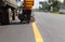 Machine eject and worker on road and traffic sign painting