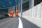 Machine eject and worker on road and traffic sign painting