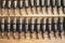 Machine gun ammo on a wooden table, bullet belt, bandoleer, chain of ammo on wooden background,cartridge 7.62 mm caliber, top view