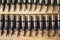 Machine gun ammo on a wooden table, bullet belt, bandoleer, chain of ammo on wooden background,cartridge 7.62 mm caliber, top view