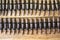 Machine gun ammo on a wooden table, bullet belt, bandoleer, chain of ammo on wooden background,cartridge 7.62 mm caliber, top view