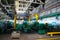 Machine shop of metallurgical works indoors room. Machining of metal by cutting on a turning and milling machine.