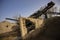 Machine sorting sand and gravel. Excavator and conveyer at the quarry