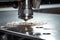 Machine using water pressure to cut through stainless steel materials