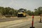 Machine Working On Highway Duplication Construction Roadworks