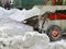 Machinery snowblower. Natural disasters winter, blizzard, heavy snow paralyzed the city, collapse. Snow covered the cyclone Europe