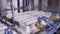 Machines create packing for bottles. Process of manufacturing plastic containers on extrusion equipment-moving mold