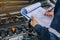 machinic man writing to the clipboard the checklist for repair machine, car service and maintenance.Services car engine machine