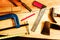 Machinist square , wood pencil, hammer, saw, clamp, Chisel, vise, tape measure, file for carpenter on wooden background tool wood