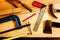 Machinist square , wood pencil, hammer, saw, clamp, Chisel, vise, tape measure, file for carpenter on wooden background tool wood