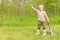 Macho little boy playing with an automatic rifle