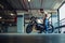 Macho man looking at right motorcycle mirror in a garage