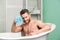 Macho man washing in bath. desire and temptation. hygiene and health. Morning shower. man wash muscular body with foam