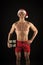 Macho muscular torso posing with gift box. Santa claus for adult girls. Sexy athletic macho muscular chest in santa