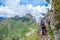 MACHU PICCHU, CUSCO, PERU- JUNE 4, 2013: Tourist climbing Huayna Picchu mountain for the best panoramic view of Machu Picchu