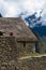 Machu Picchu grass roof stone bldg