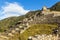 Machu Picchu green terraces and ruins with mountains in the back