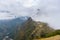 Machu Picchu illuminated by the first sunlight coming out from the opening clouds. The Inca`s city is the most visited travel des