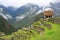 Machu Picchu main tourist viewpoint surrounded by fog in rainy season